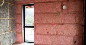 Roof insulation installed beneath a modern metal roof to improve home warmth and energy efficiency