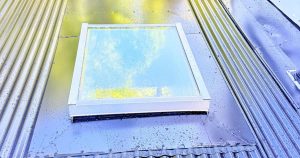 Professional Skylight Installation on a modern metal roof to bring natural light into the home.